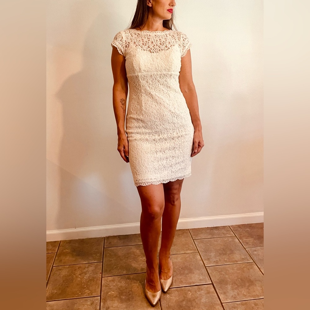 White Lace Short sleeve dress. Size 4, fitted, zipper back, originally $250